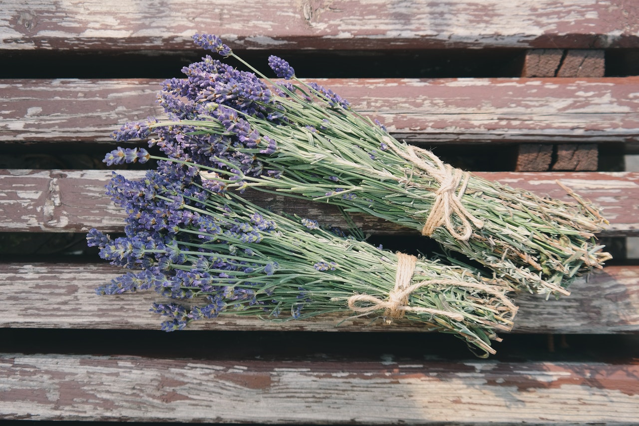 Lavender bouquets laying on wooden table